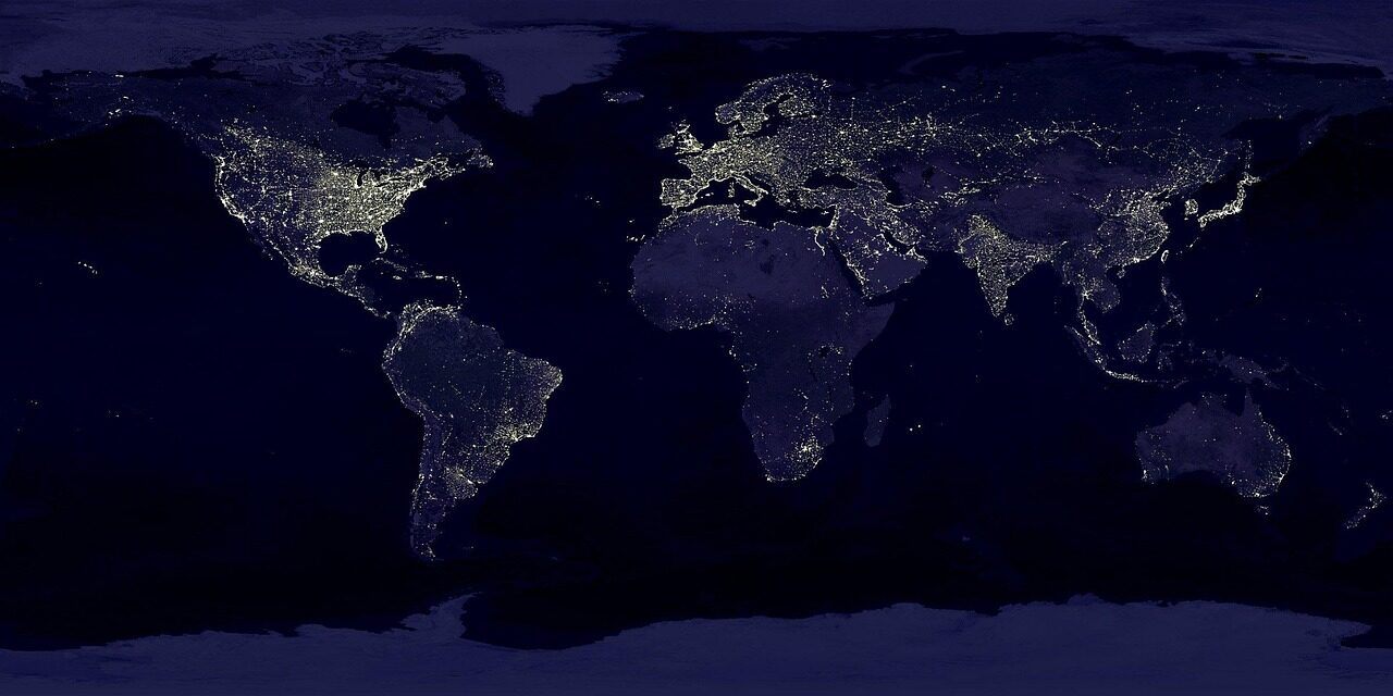 Agricultural analysts reviewing earth-observation data across farmland and water resources.