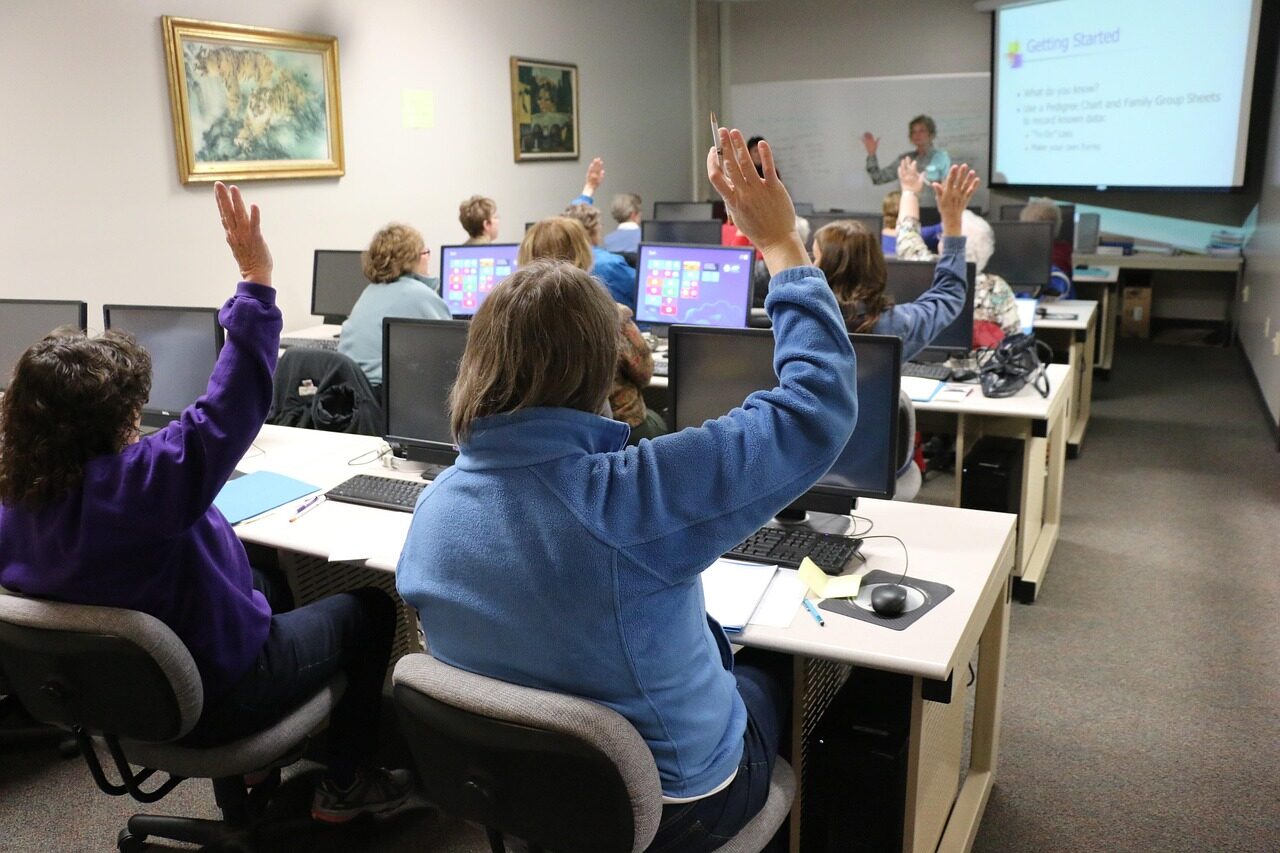 Defenders working through a live-fire exercise in a cyber-range training suite.