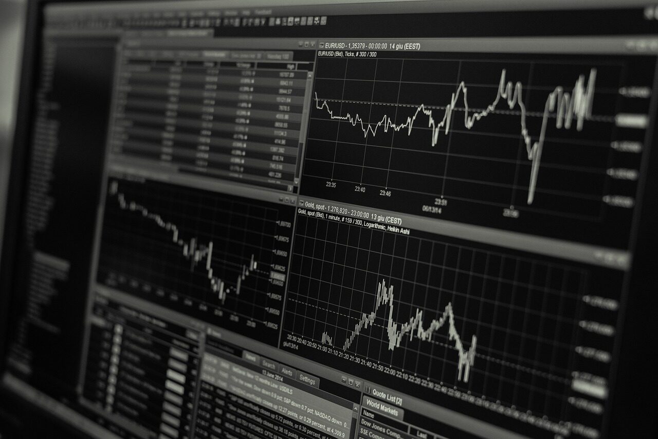 Analysts monitoring live transaction dashboards in a financial security operations centre.