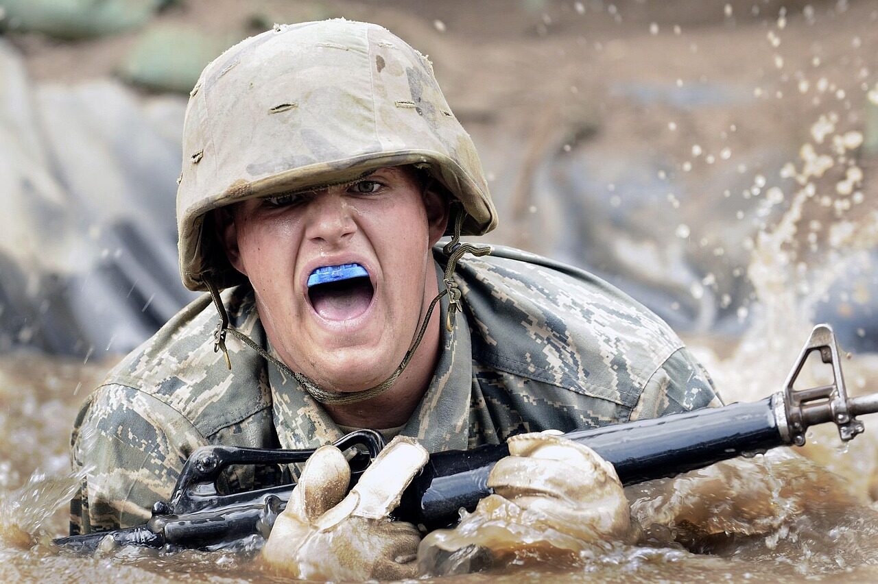 A special-forces operator handling a lightweight carbine during a live-fire training drill.